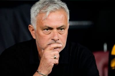 Jose Mourinho sitting in the dugout