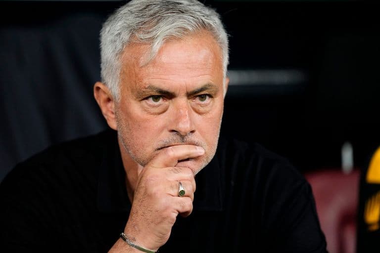 Jose Mourinho sitting in the dugout