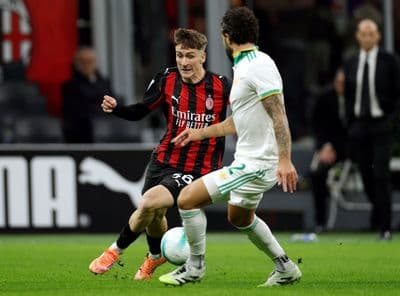 lexis Saelemaekers of Milan and Mario Hermoso of Roma in action during the Serie A AC MILAN v AS ROMA at San Siro Stadium.